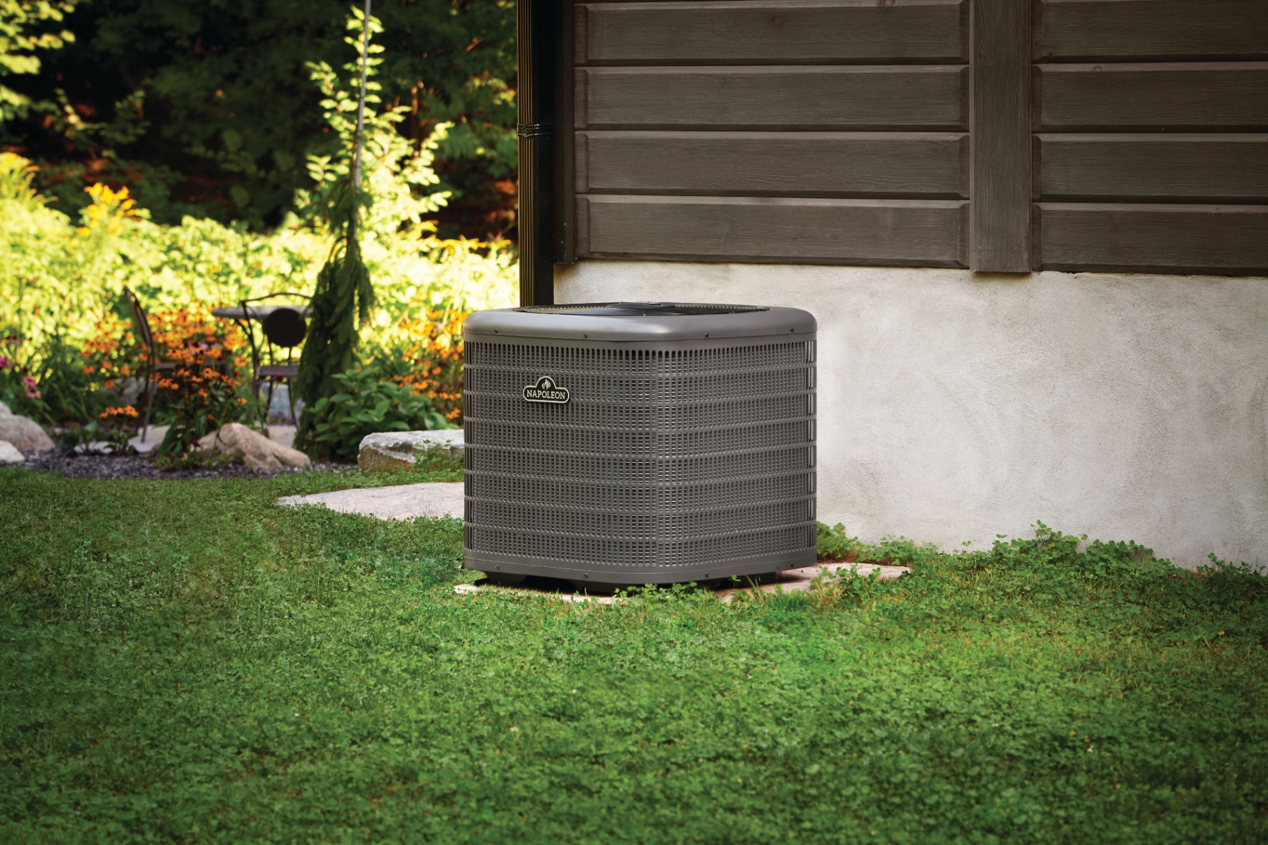 Napoleon air conditioner installed in a lush green backyard